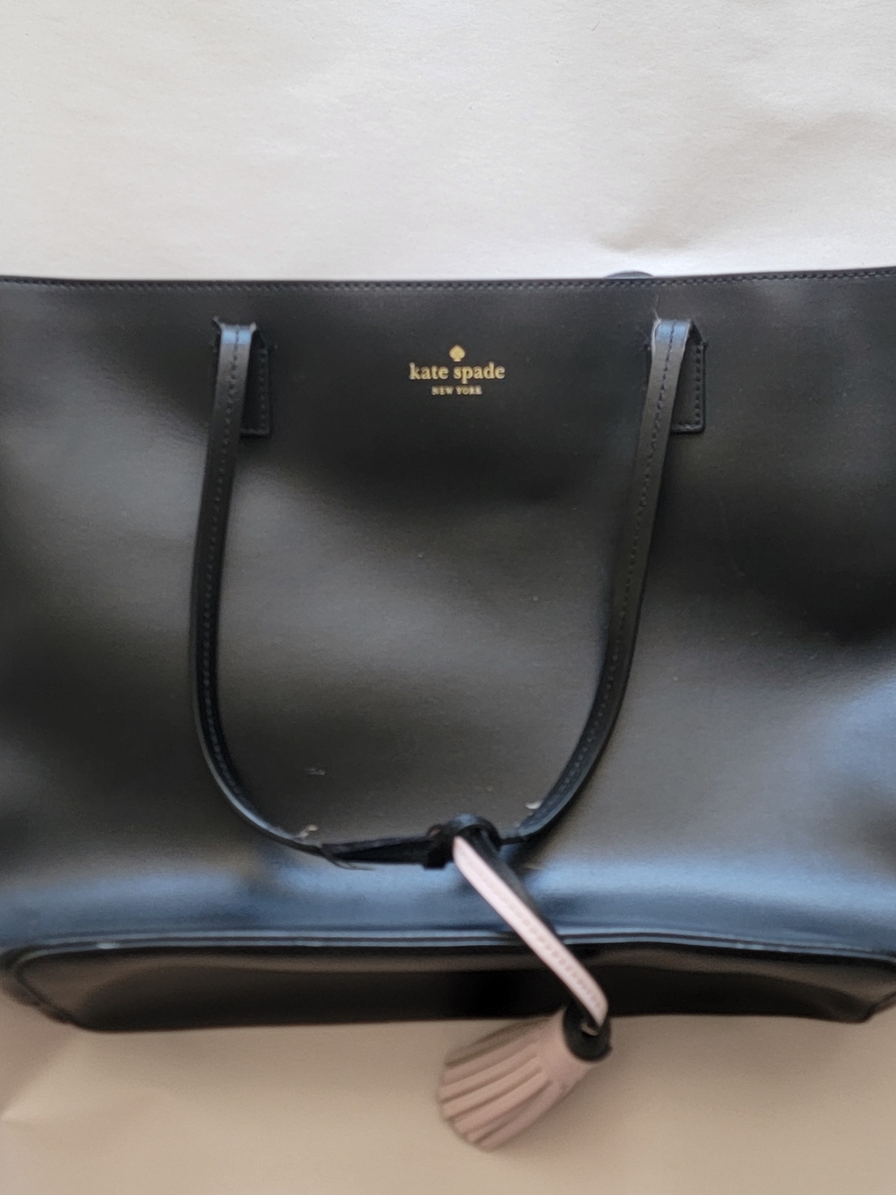 kate spade Black Leather Tote with Pink Tassel Charm